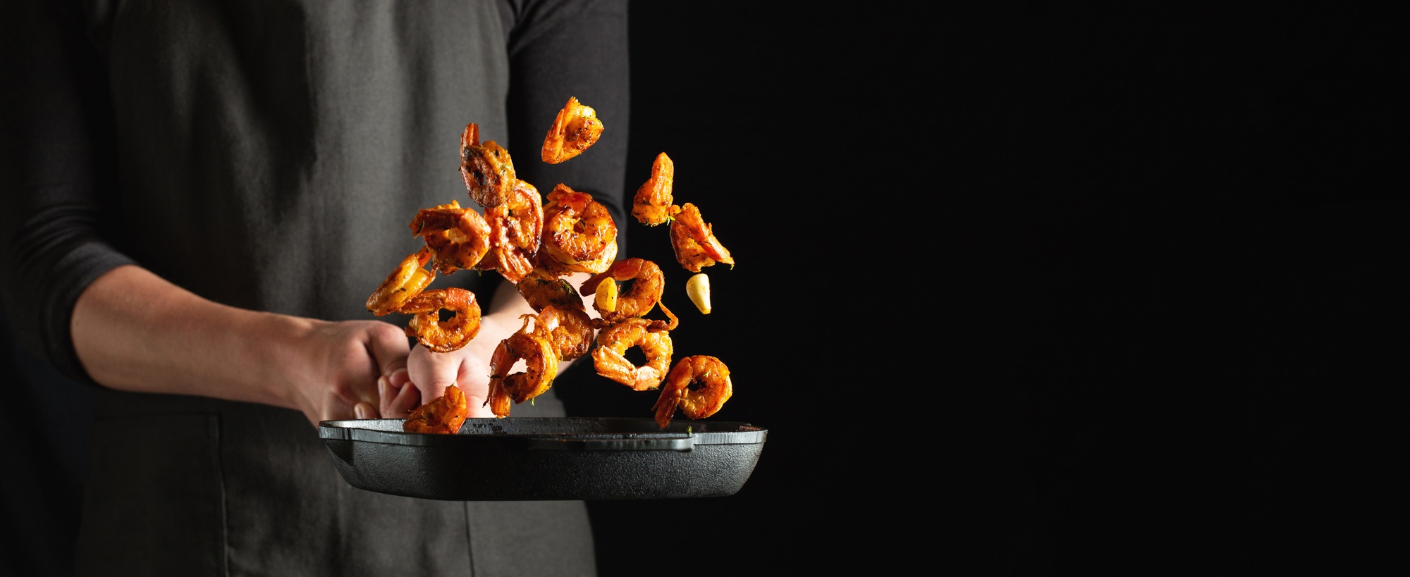 Professional chef prepares shrimps or langoustines